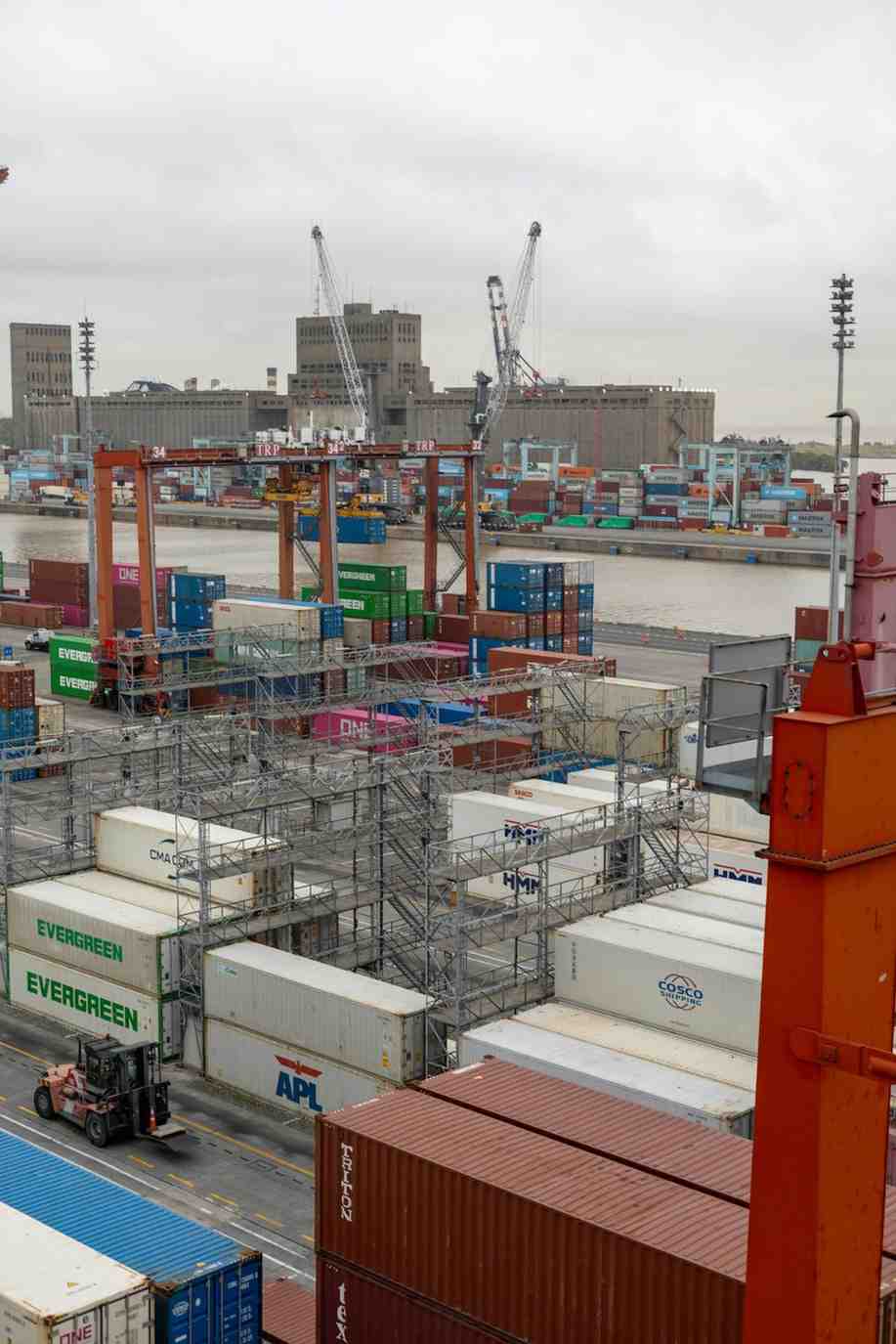 Shipping containers at UK port awaiting customs clearance and inland logistics coordination